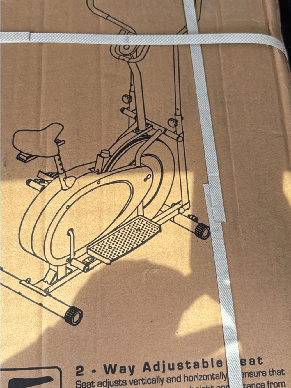 Adjustable 2-Way Seat Exercise Bike - Brown Cardboard Illustration